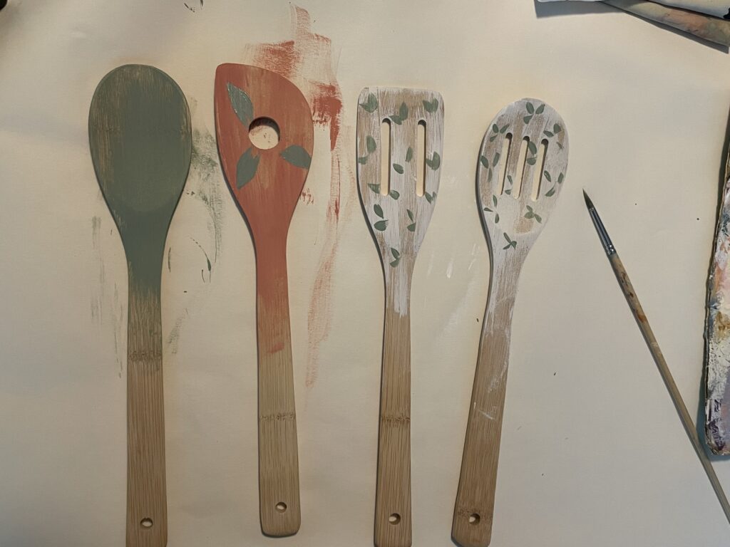 Painting leaves onto the spoons 